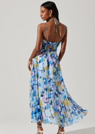 ASTR The Label Aquata Floral Maxi Dress. Front V-neck strappy detail, keyhole cutout Halter tie straps, plisse fabrication, side cutouts Side slit, hidden back zipper closure.