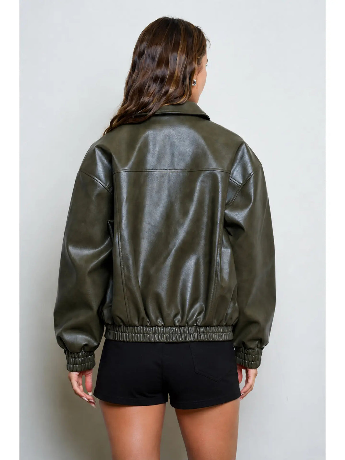 Women’s olive collared bomber jacket featuring a relaxed fit, zip-front closure, long sleeves, and gathered elastic cuffs and hem.