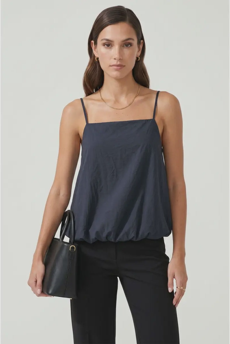 Navy bubble cami tank featuring a square neckline, adjustable spaghetti straps, a relaxed flowy silhouette, and a gathered bubble hem