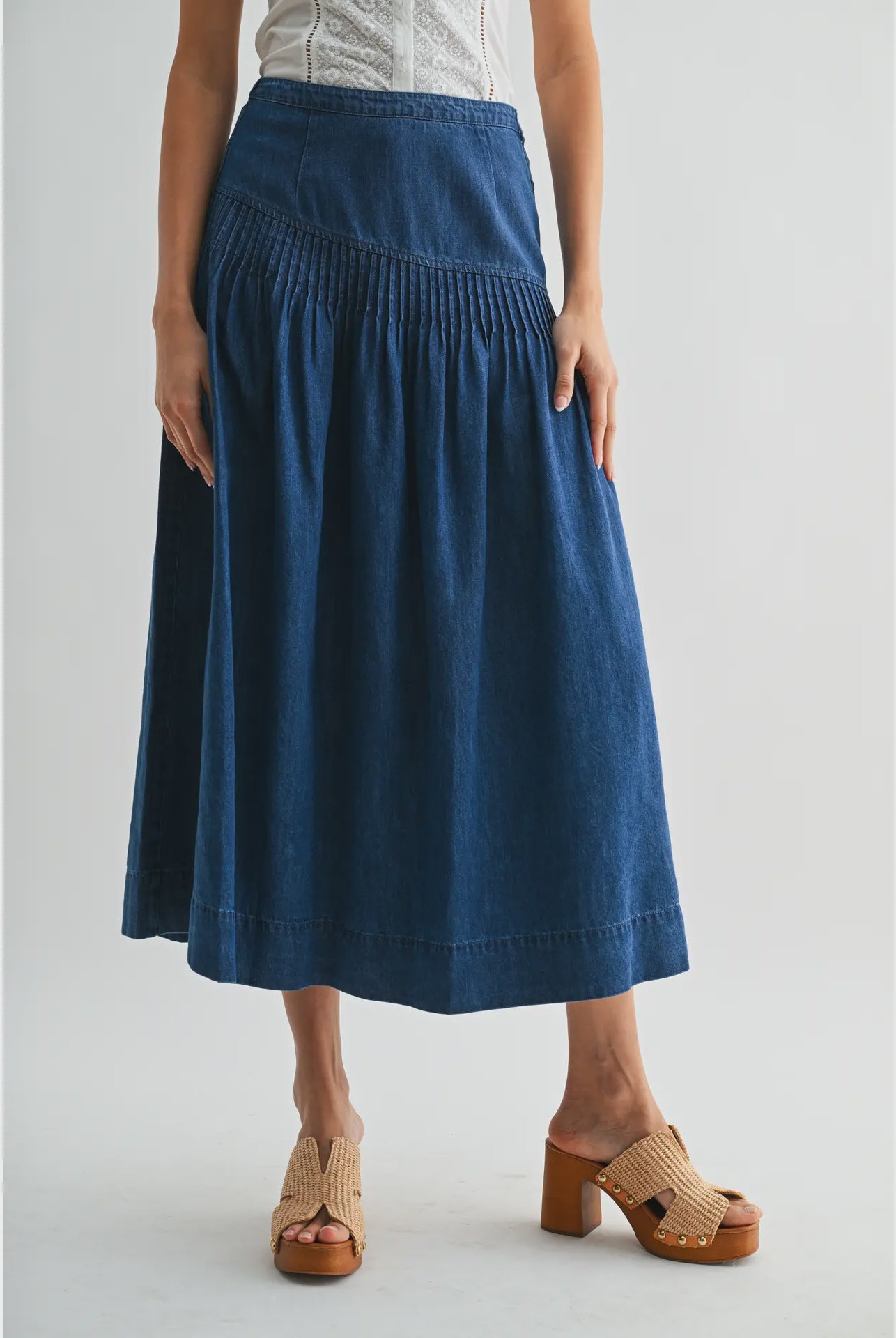 Heritage Midi Denim Skirt in classic blue denim, featuring a high-waisted fit and softly flared silhouette.
