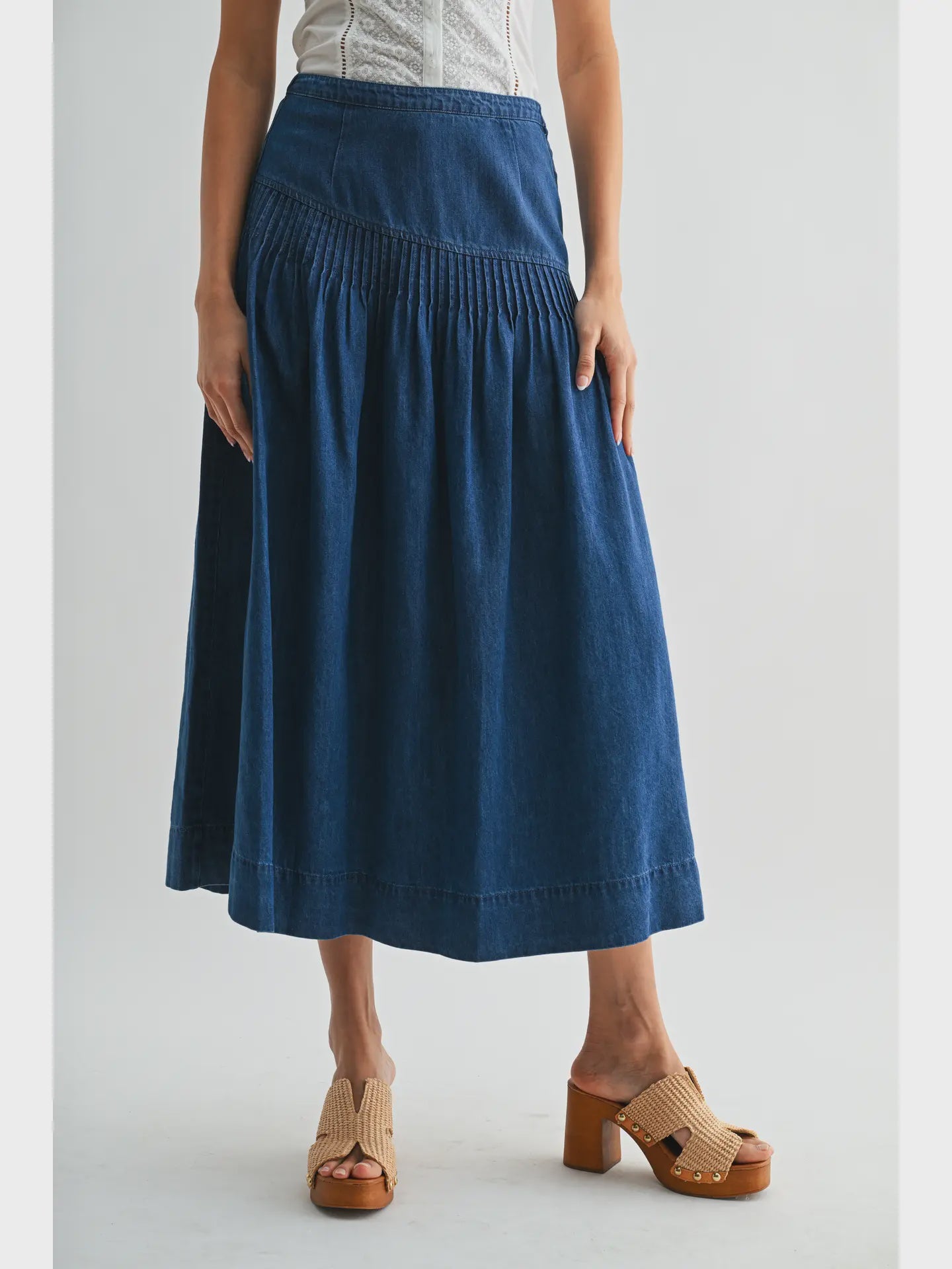 Heritage Midi Denim Skirt in classic blue denim, featuring a high-waisted fit and softly flared silhouette.