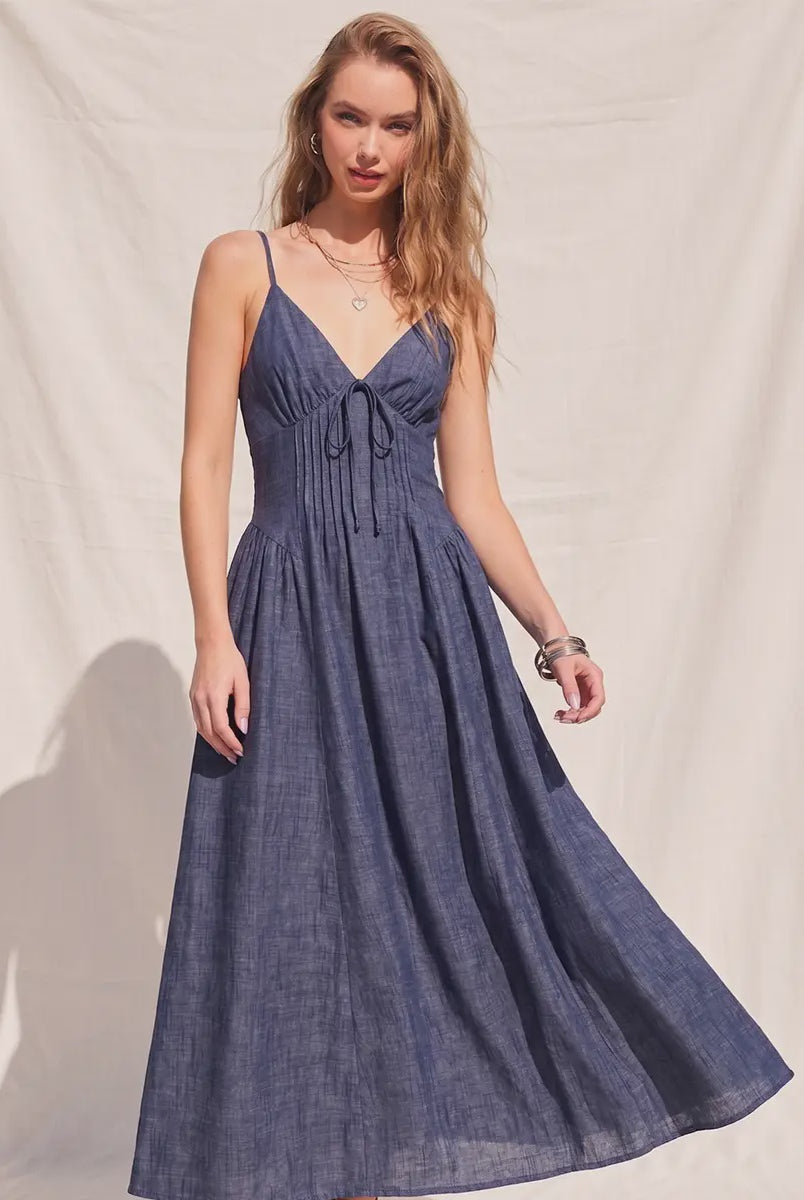 Women's denim fit-and-flare midi dress with a V-neckline, corset waist detailing, adjustable straps, a smocked back, and a flattering feminine silhouette.