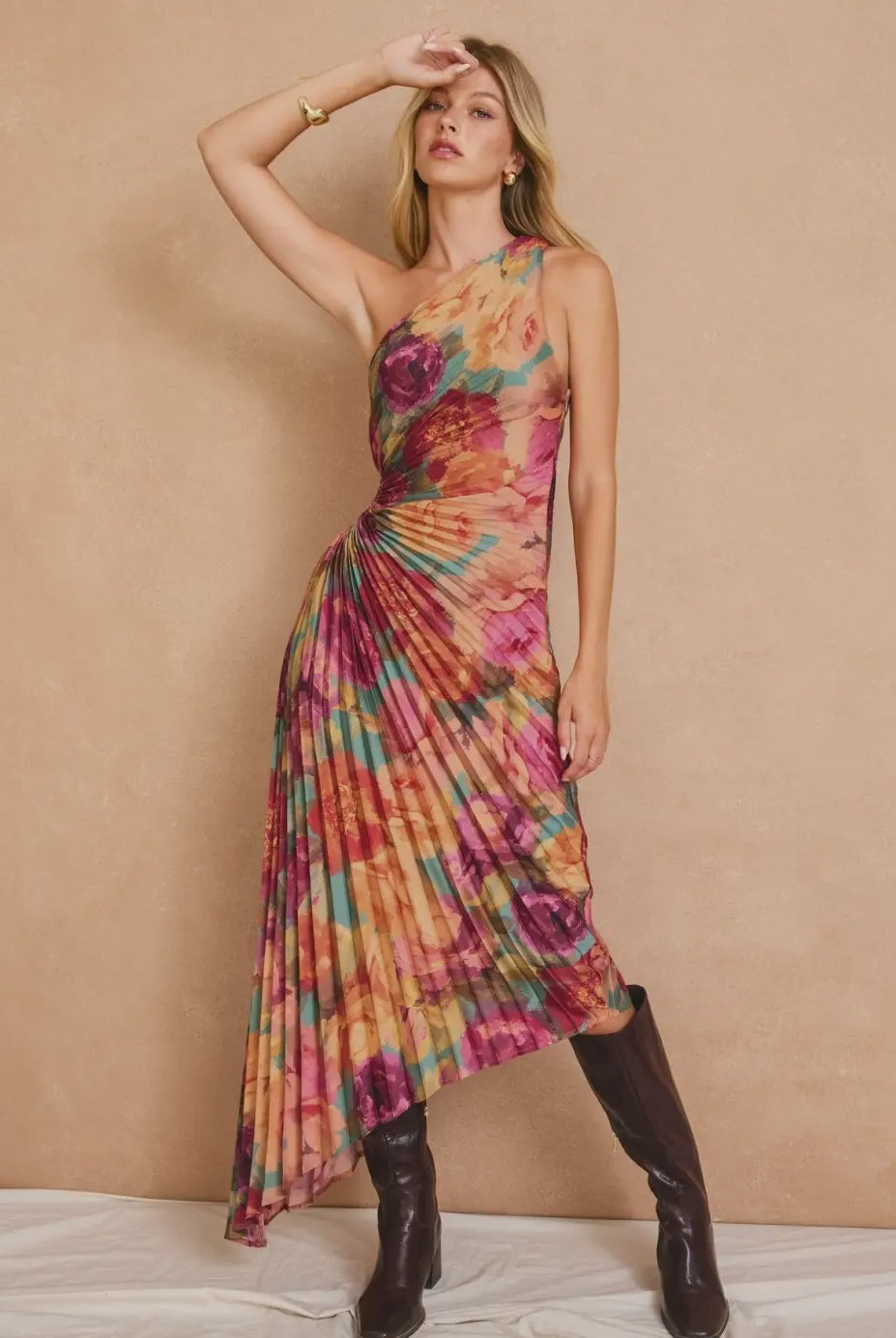 Romantic floral satin maxi dress featuring a pleated one-shoulder neckline, asymmetrical hemline, side keyhole detail, hidden side zipper closure, and fully lined interior.