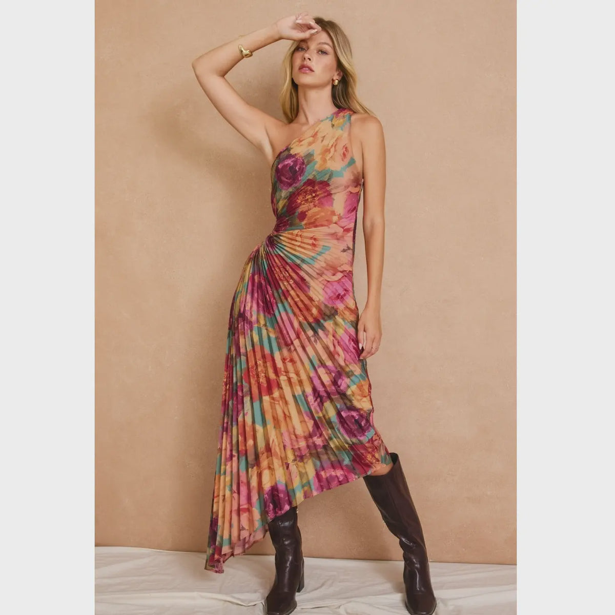 Romantic floral satin maxi dress featuring a pleated one-shoulder neckline, asymmetrical hemline, side keyhole detail, hidden side zipper closure, and fully lined interior.