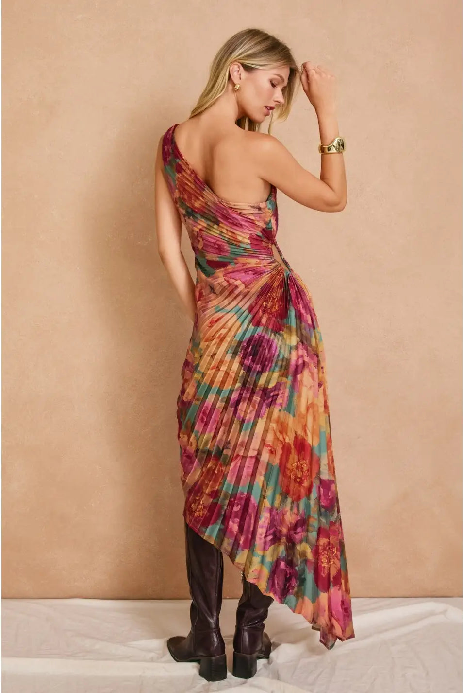 Romantic floral satin maxi dress featuring a pleated one-shoulder neckline, asymmetrical hemline, side keyhole detail, hidden side zipper closure, and fully lined interior.