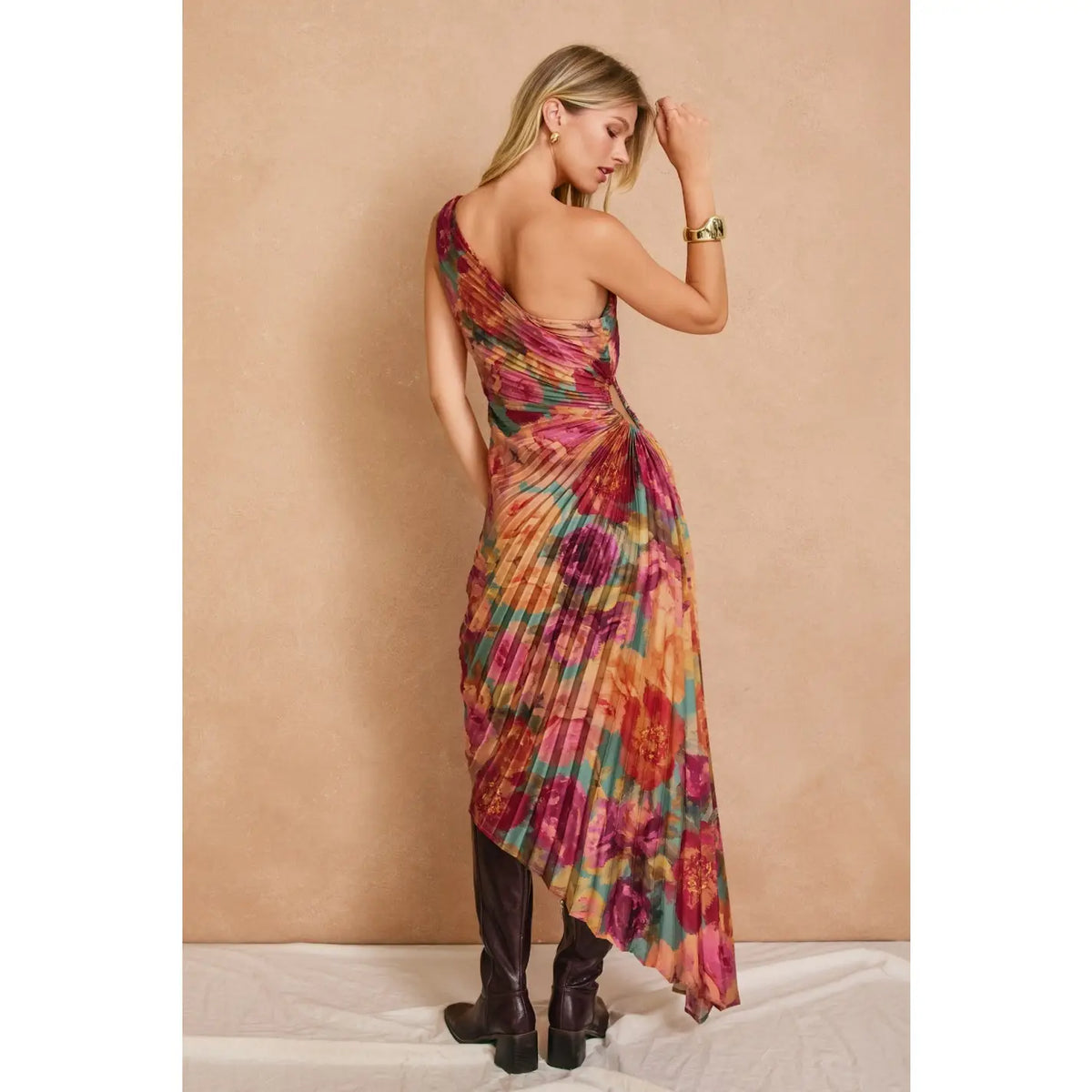 Romantic floral satin maxi dress featuring a pleated one-shoulder neckline, asymmetrical hemline, side keyhole detail, hidden side zipper closure, and fully lined interior.