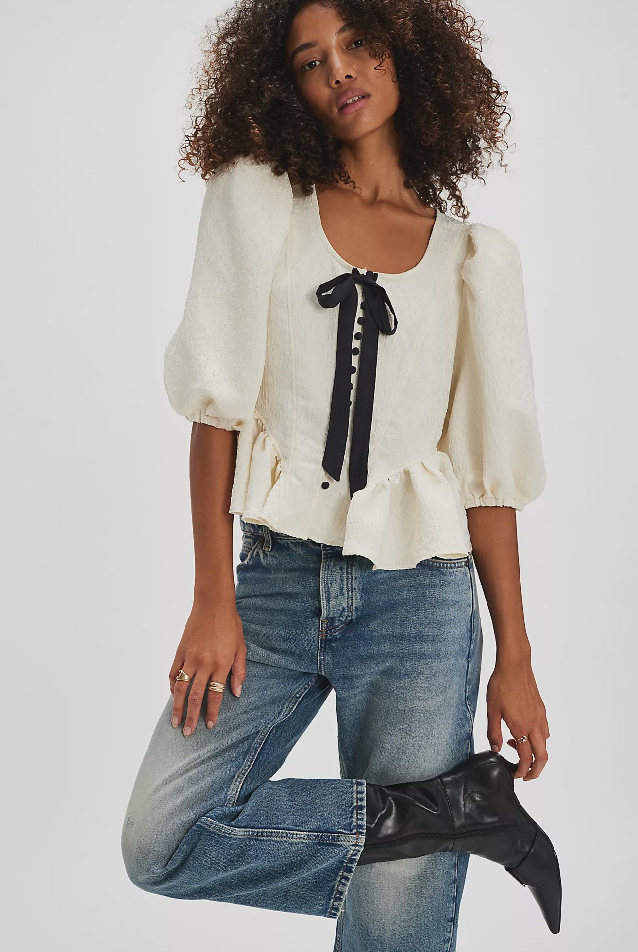 A boho cottage chic cream top with a big black bow