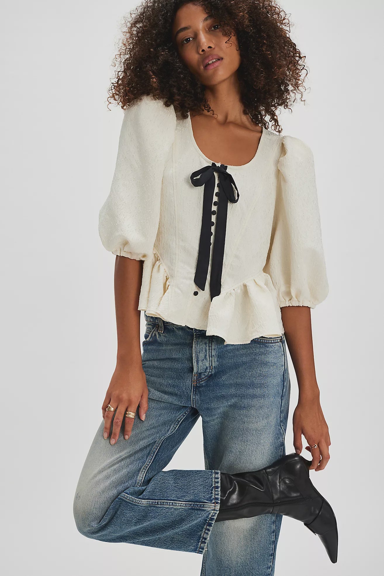 A boho cottage chic cream top with a big black bow