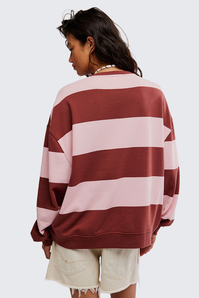 woman wearing strawberry wine combo striped oversized crew