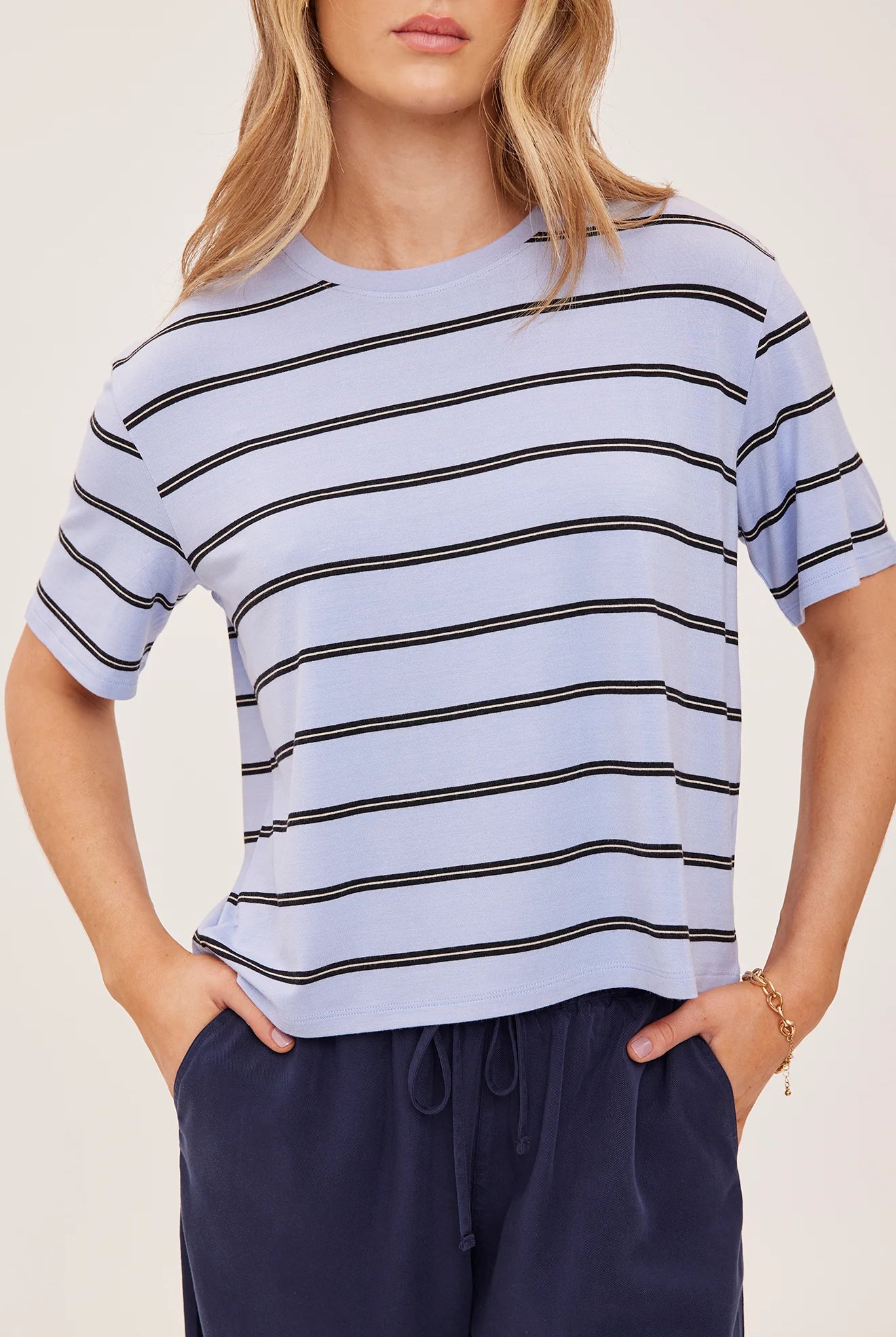 Women's relaxed oversized crewneck t-shirt featuring sky blue and white stripes, crafted from soft jersey knit with short sleeves and a comfortable oversized silhouette.