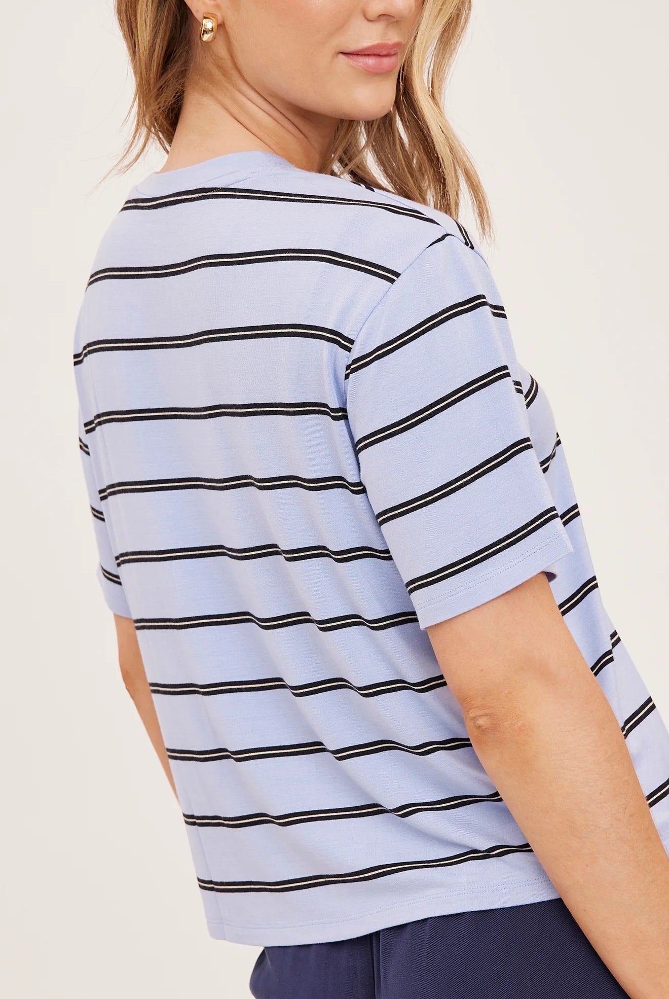 Women's relaxed oversized crewneck t-shirt featuring sky blue and white stripes, crafted from soft jersey knit with short sleeves and a comfortable oversized silhouette.
