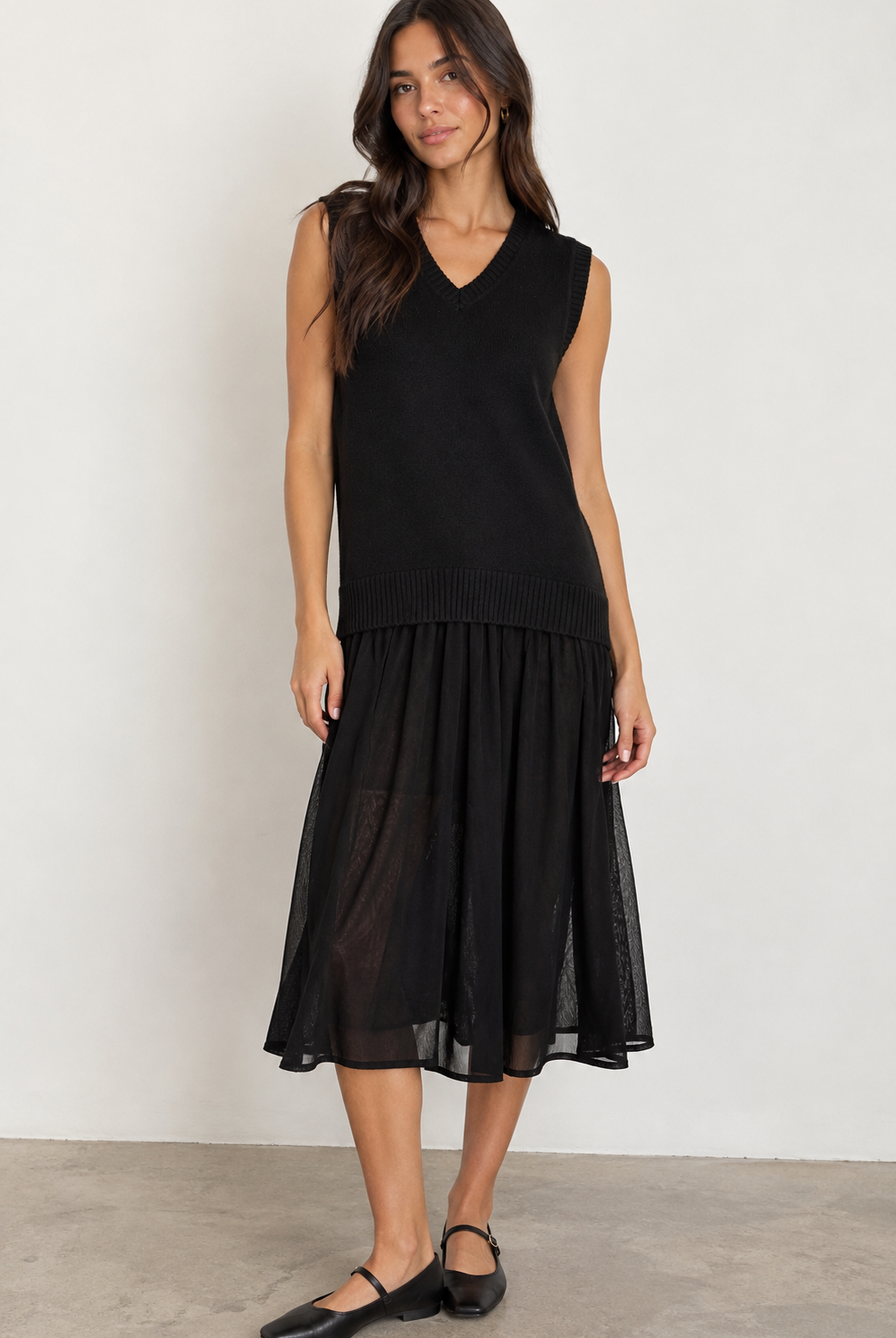 ICHI IHBANUS Dress in Black featuring a soft sleeveless knit bodice with a V-neckline, ribbed trim, and a lightweight sheer mesh midi skirt. Designed with a relaxed silhouette and contrasting textures for an effortlessly chic, feminine look.