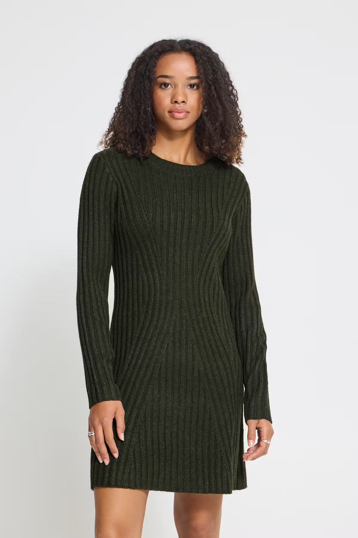 Rib-knit mini dress featuring a straight silhouette, classic round neckline, long sleeves, and a soft textured finish.