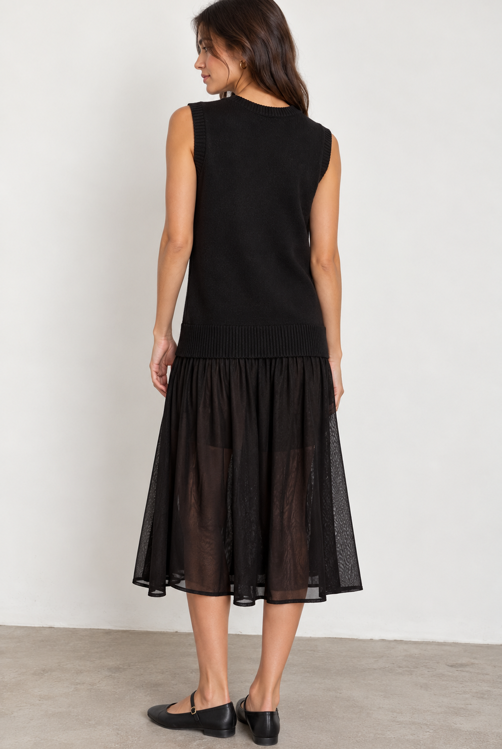 ICHI IHBANUS Dress in Black featuring a soft sleeveless knit bodice with a V-neckline, ribbed trim, and a lightweight sheer mesh midi skirt. Designed with a relaxed silhouette and contrasting textures for an effortlessly chic, feminine look.