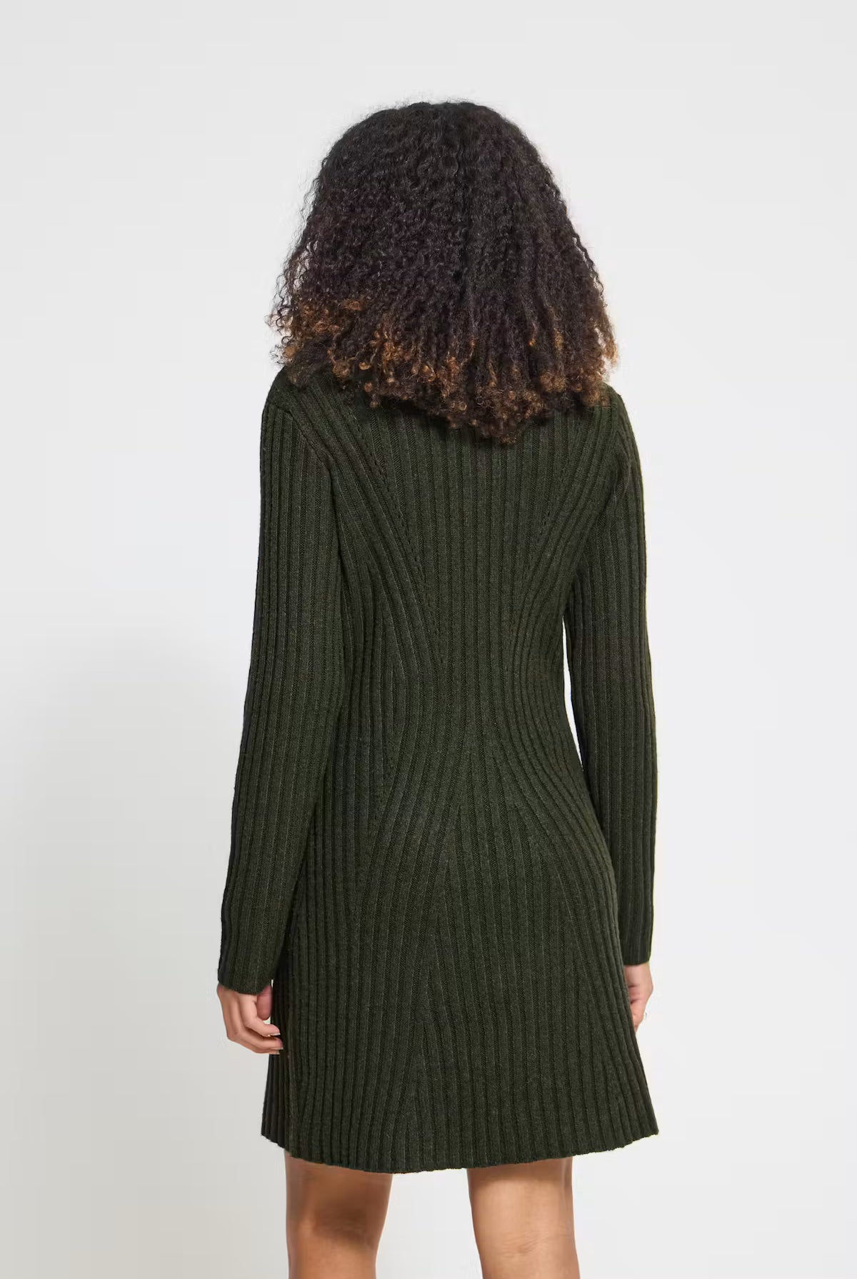 Rib-knit mini dress featuring a straight silhouette, classic round neckline, long sleeves, and a soft textured finish.