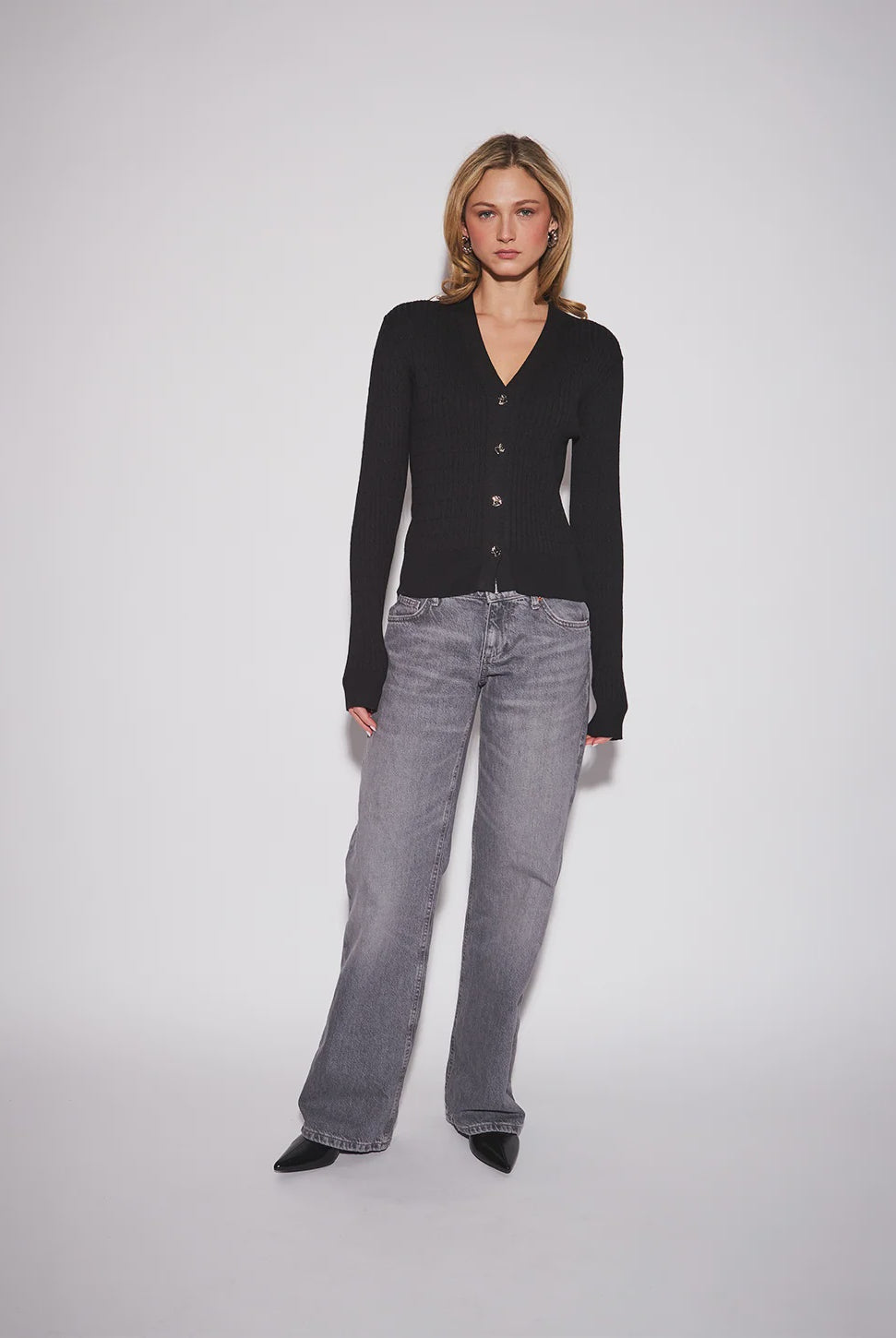 John & Jenn Maura Cardigan featuring a flattering V-neckline, delicate button-front closure, long sleeves, and a relaxed silhouette in a soft knit fabric for a polished, feminine look.
