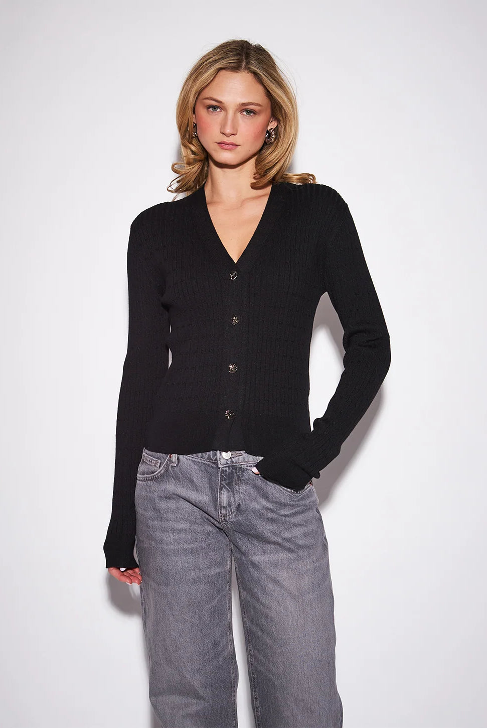 John & Jenn Maura Cardigan featuring a flattering V-neckline, delicate button-front closure, long sleeves, and a relaxed silhouette in a soft knit fabric for a polished, feminine look.