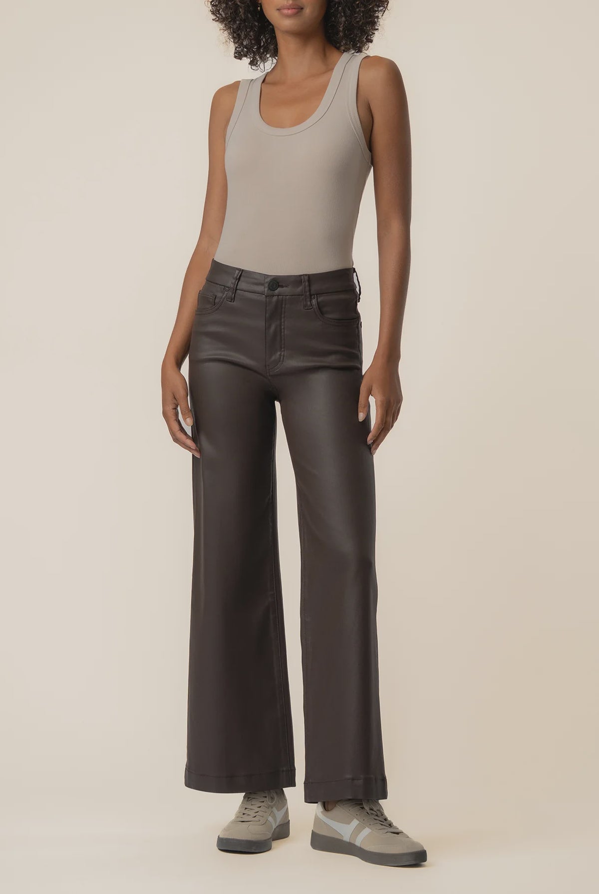 Coated wide-leg jeans featuring a sleek finish, Fab Ab front pockets, ankle-grazing length, and raw wide hems for a modern silhouette.