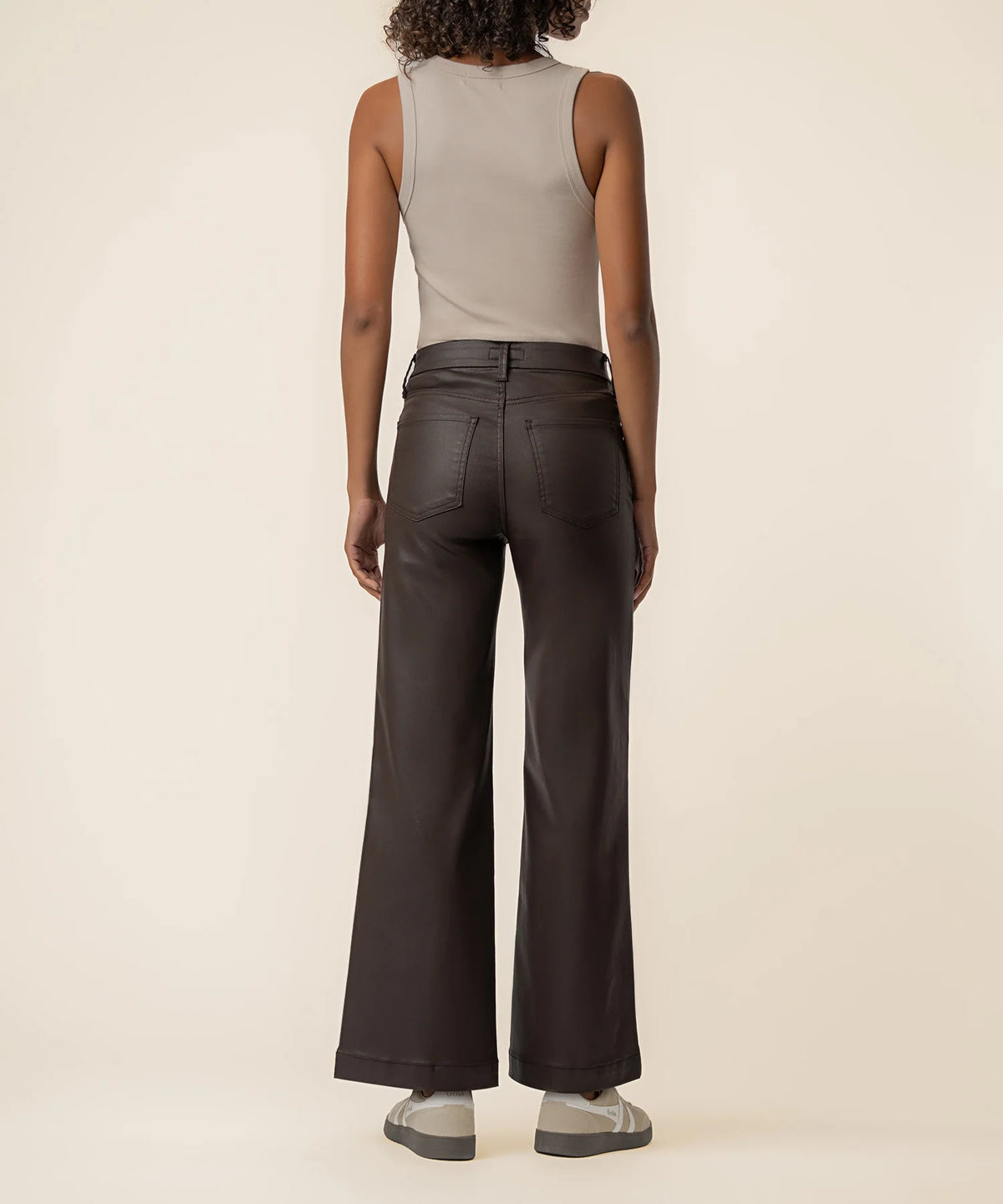 Coated wide-leg jeans featuring a sleek finish, Fab Ab front pockets, ankle-grazing length, and raw wide hems for a modern silhouette.
