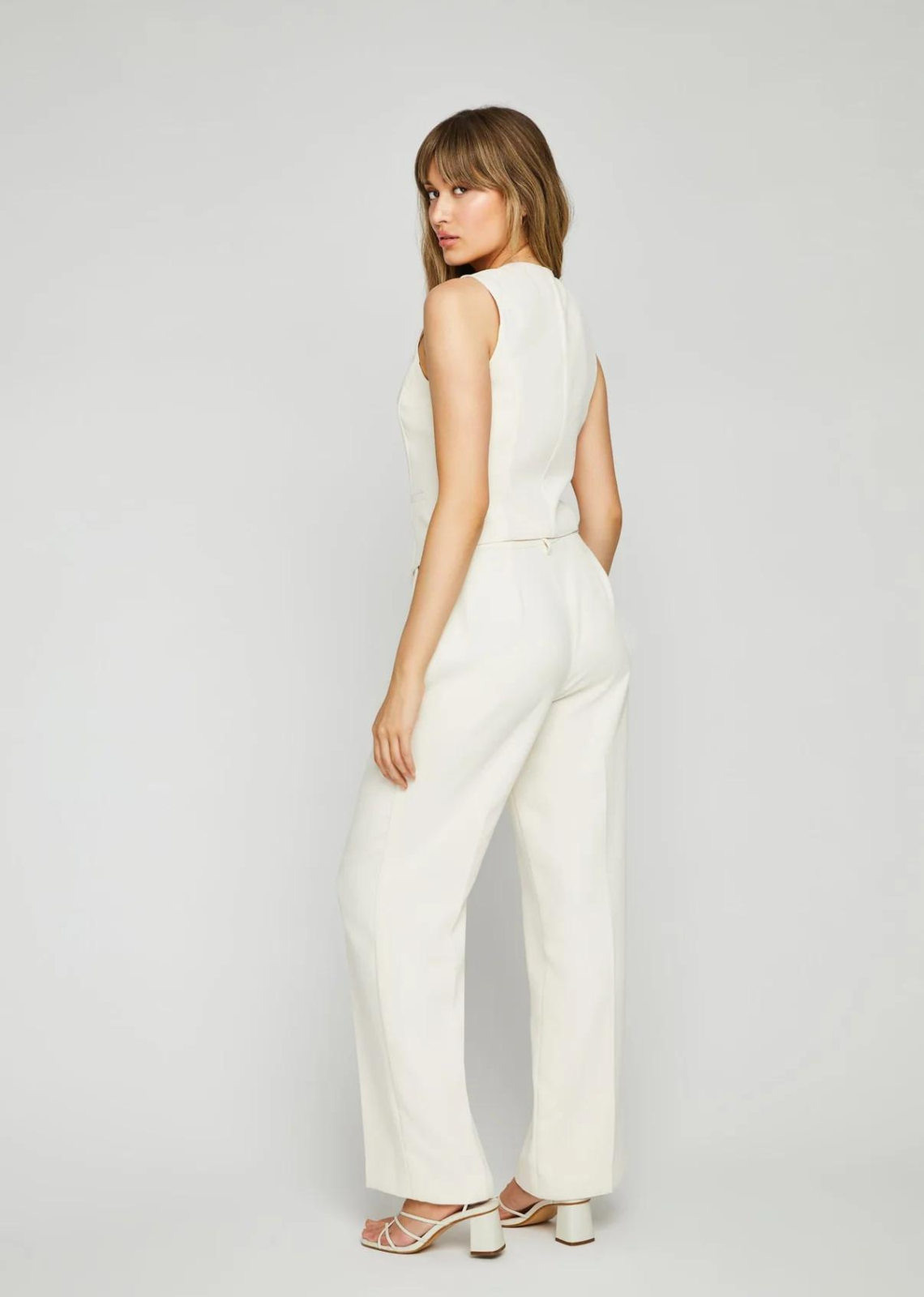 Made of a crepe suiting fabric, the Lottie is an effortless trouser pant silhouette designed for everyday wear. Features include side seam pockets, front pleats, and back waist darts for a perfectly tailored look. Pair with the Freya vest or Hallie blazer for a coordinated look.