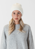 Lyla & Luxe Apres Ski Hat- Ivory.Introducing the Apres Ski Hat, your go-to accessory for embracing the après-ski vibe with flair and warmth. Made from high-quality materials, the Apres Ski Hat features a soft and insulating knit  construction that ensures optimal comfort in chilly weather conditions. Available in a range of stylish colors to suit your
personal taste, the Apres Ski Hat is the perfect finishing touch to any winter ensemble.
