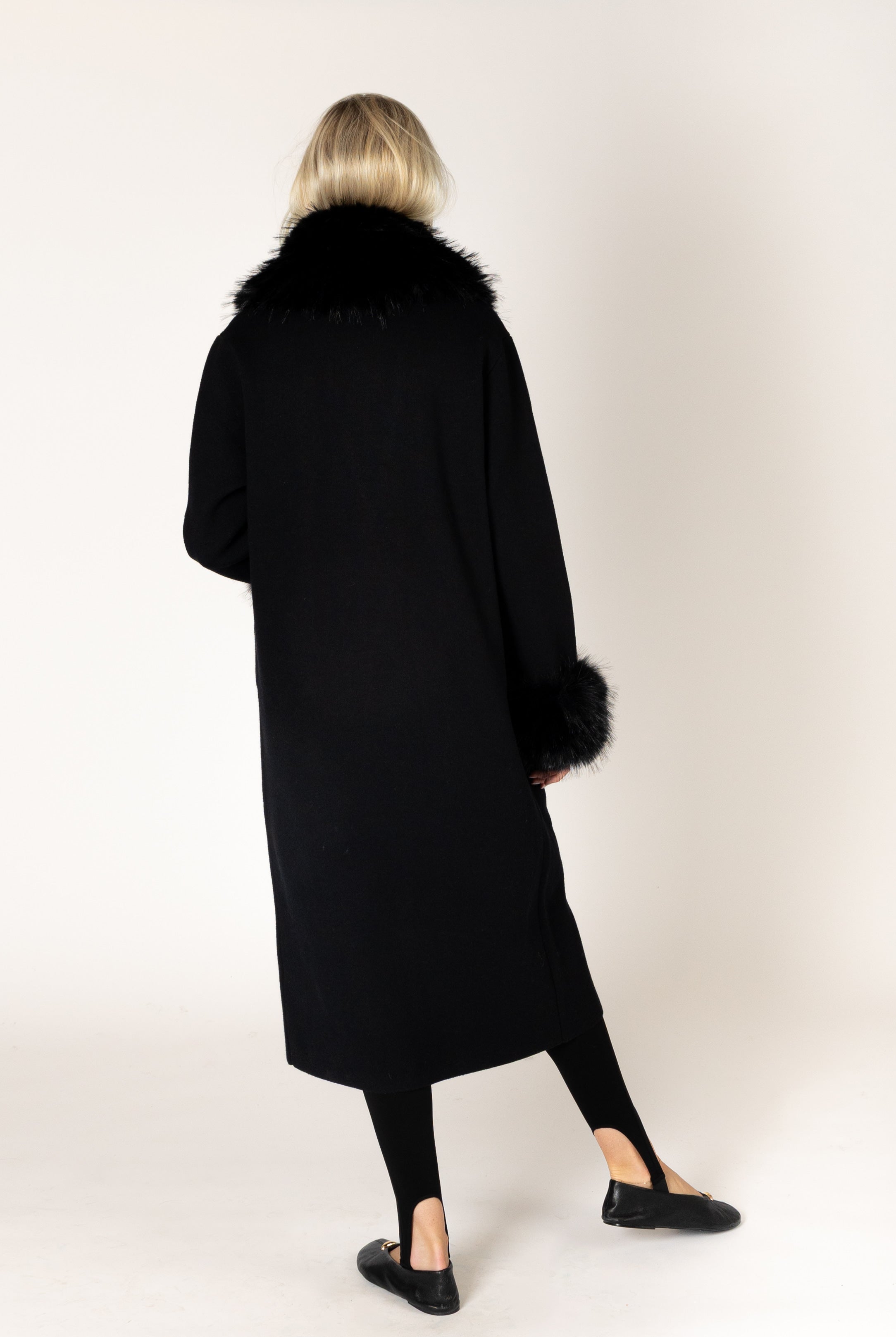 Make a statement this season with the elevated Vicki Fur Coat, designed with luxurious eco faux fur trim at the collar and cuffs for a touch of timeless glamour. Featuring a flattering longline silhouette, a classic notch collar, and a refined three-button closure, this sophisticated coat combines elegance with everyday wearability. Crafted to keep you warm while elevating any outfit, it's the perfect outerwear piece for both special occasions and everyday sophistication.
**Care:** Hand wash cold. Lay flat