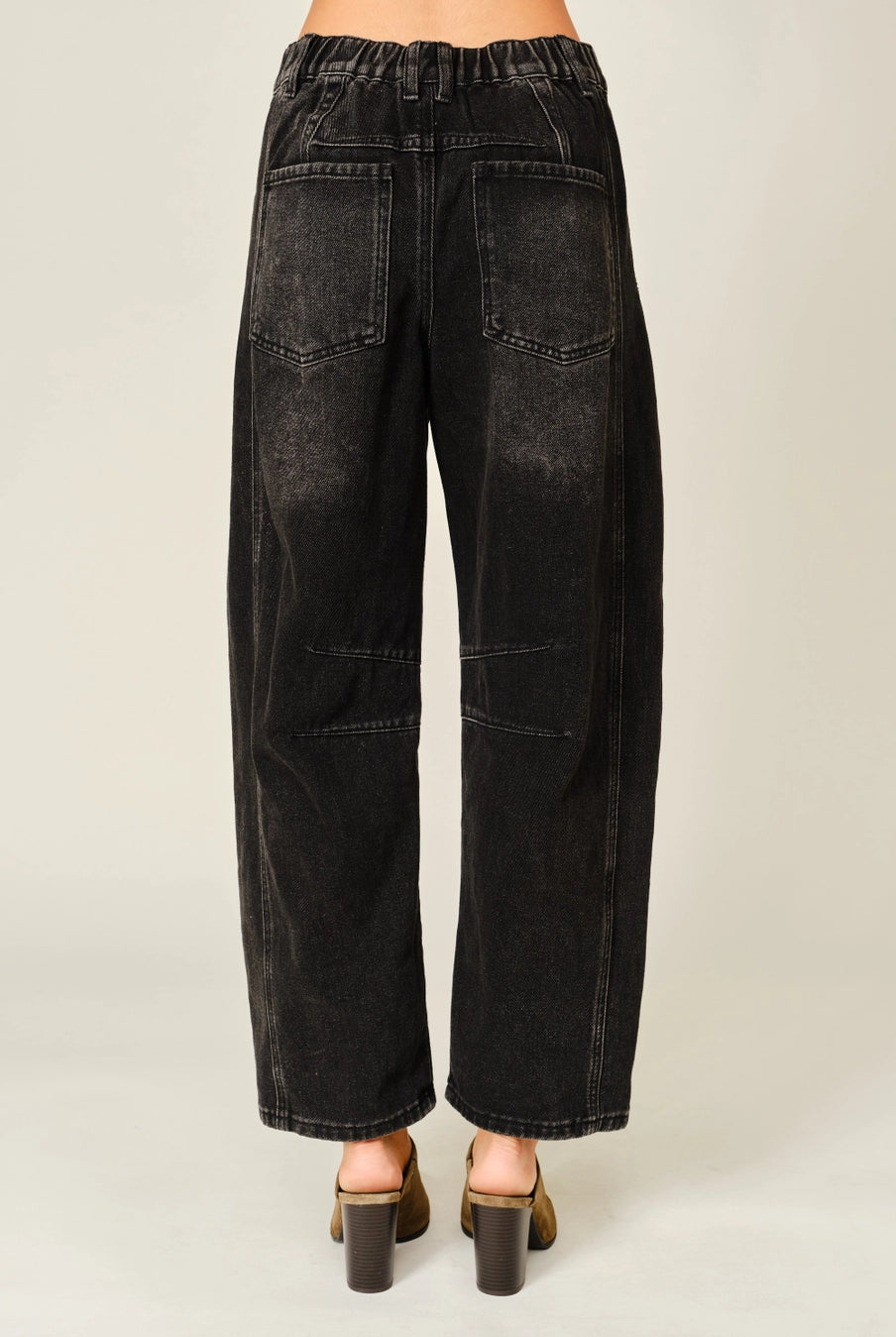 Women’s washed black barrel jeans featuring tonal floral embroidery, high-rise waist, five-pocket styling, relaxed curved leg, and cropped ankle-length fit.