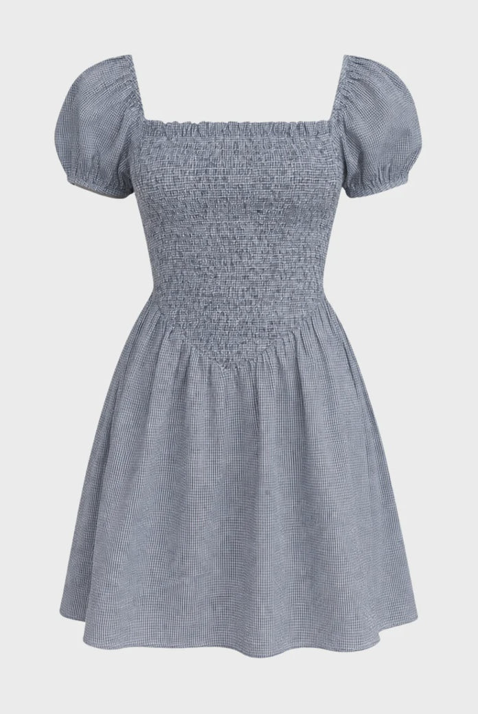 Blue checkered dress with puff sleeves on a light gray background