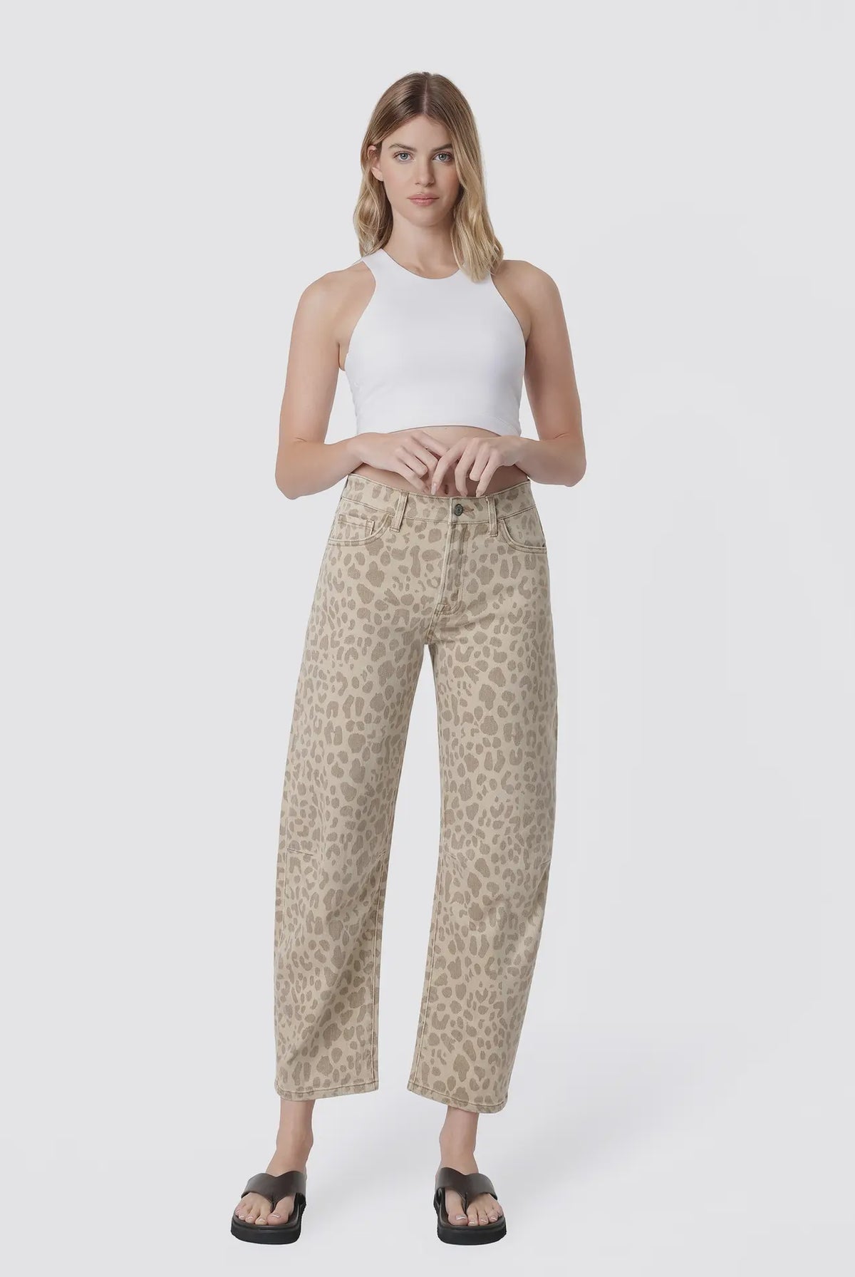 Women’s high-rise barrel jeans in a beige leopard print featuring a relaxed curved-leg fit, five-pocket styling, and cropped ankle length.