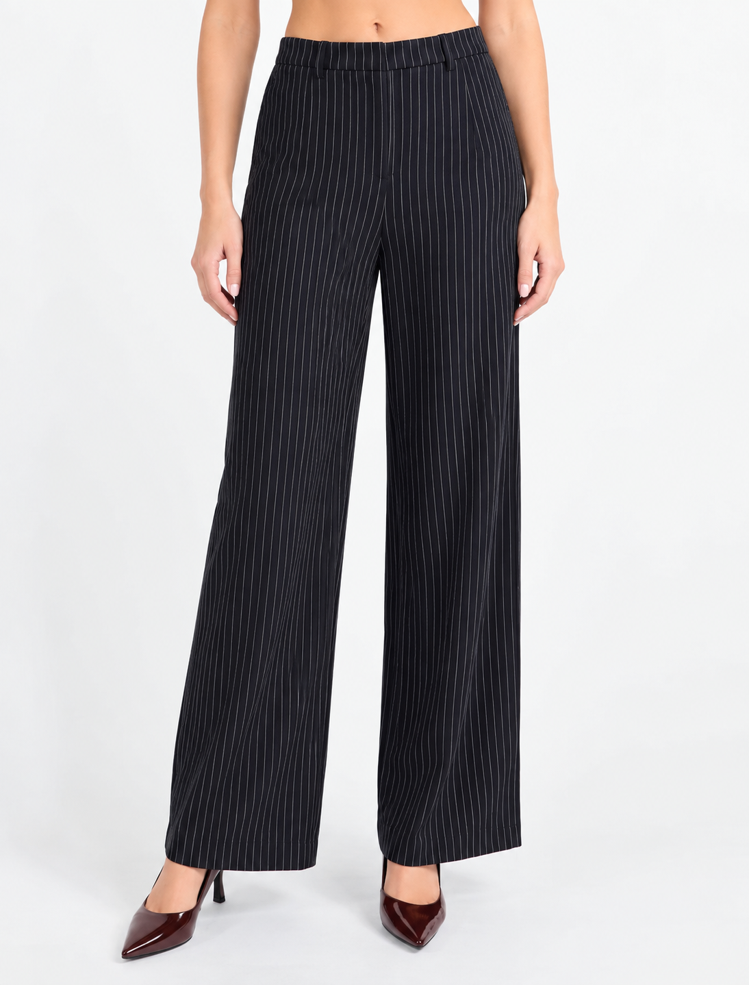 Sadie & Sage East Gate Pinstripe Pants featuring a flattering high-rise waist, relaxed wide-leg silhouette, and classic pinstripe pattern, designed to pair with the matching East Gate Pinstripe Waistcoat.