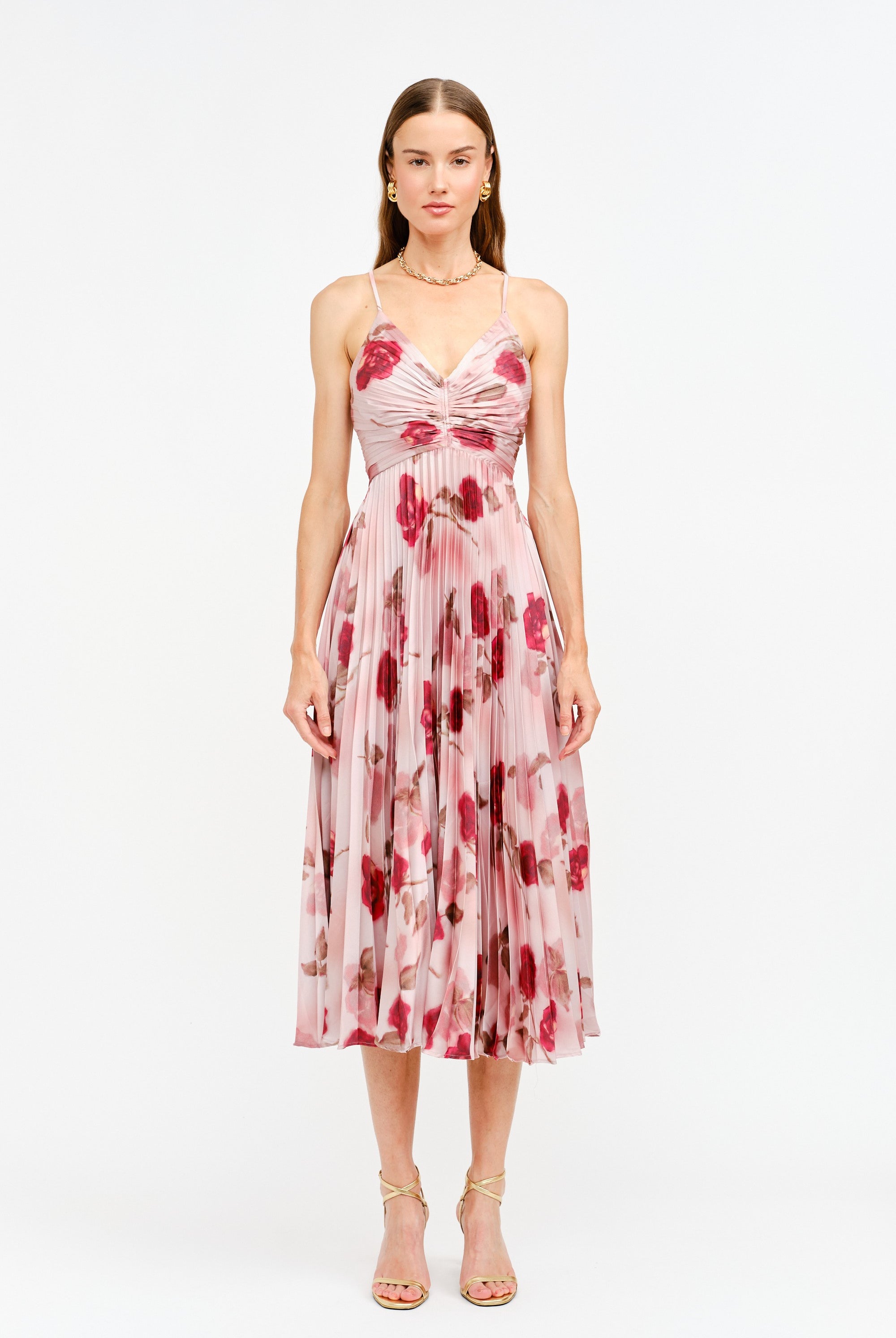 Woman wearing a floral dress on a white background