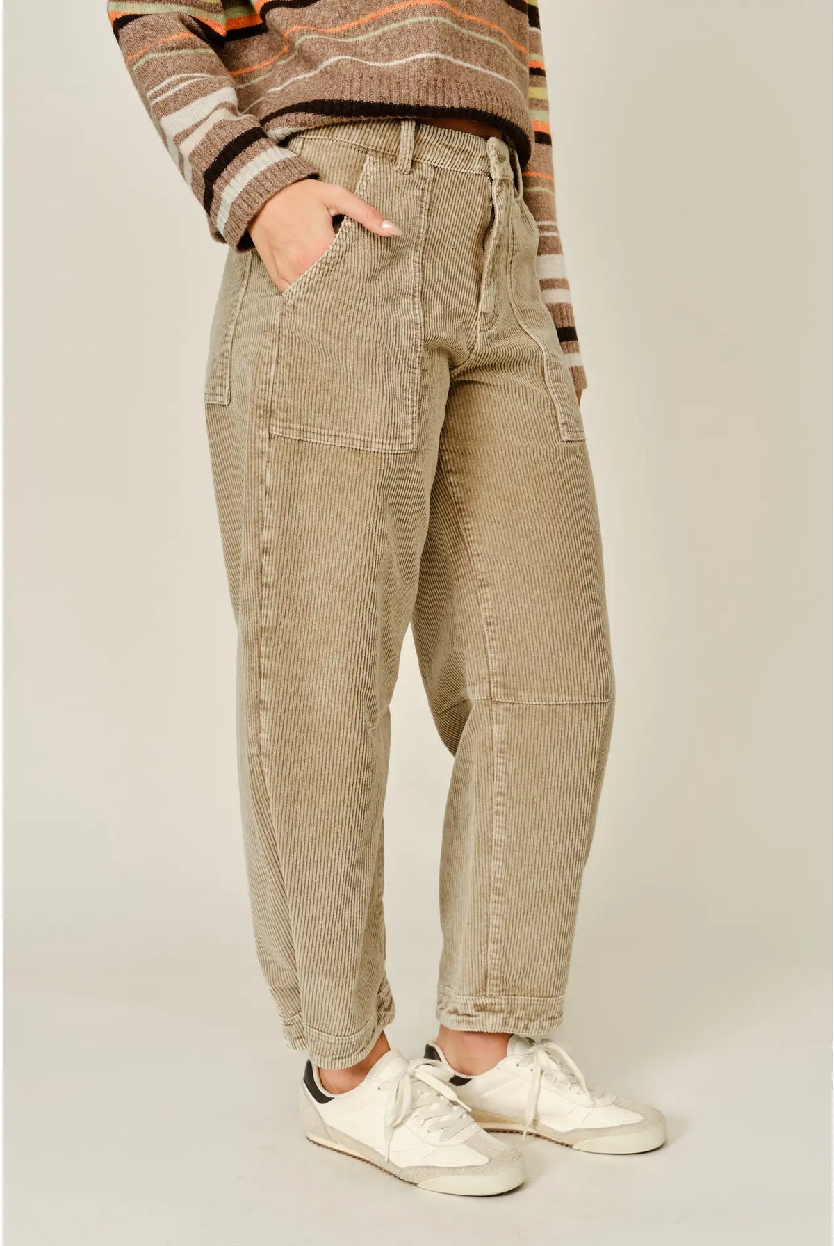 Thea Corduroy Barrel Pants in Taupe featuring a high-rise waist, relaxed barrel-leg silhouette, soft textured corduroy fabric, oversized front patch pockets, subtle seam detailing, and tapered ankle-length hems.