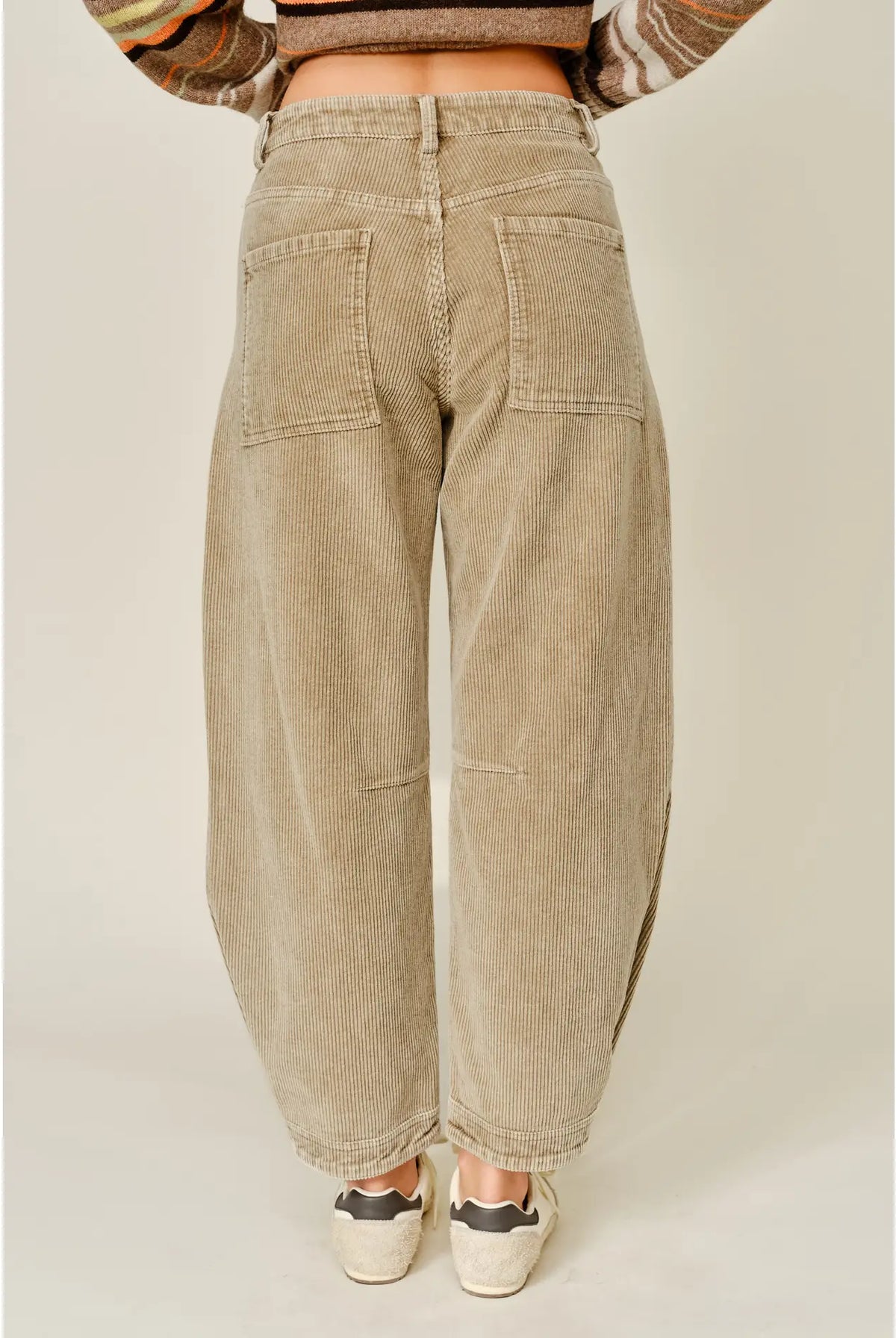 Thea Corduroy Barrel Pants in Taupe featuring a high-rise waist, relaxed barrel-leg silhouette, soft textured corduroy fabric, oversized front patch pockets, subtle seam detailing, and tapered ankle-length hems.