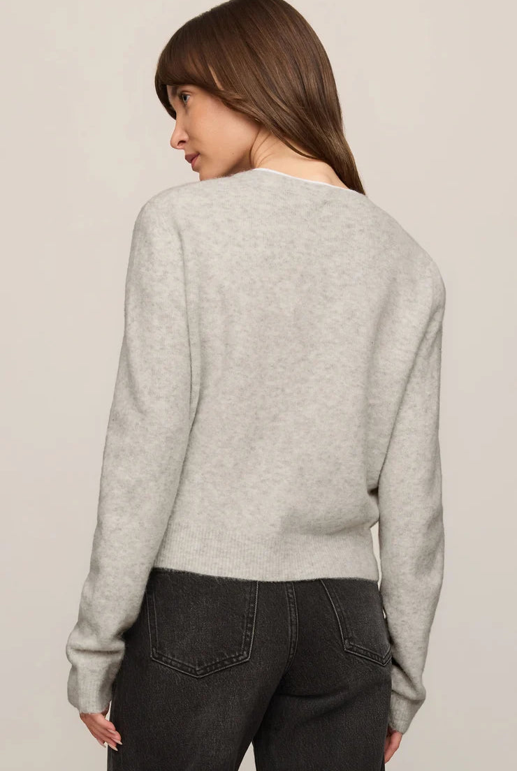 Relaxed crewneck cardigan crafted from cozy sweater yarn with a classic button-front closure and easy layering silhouette.