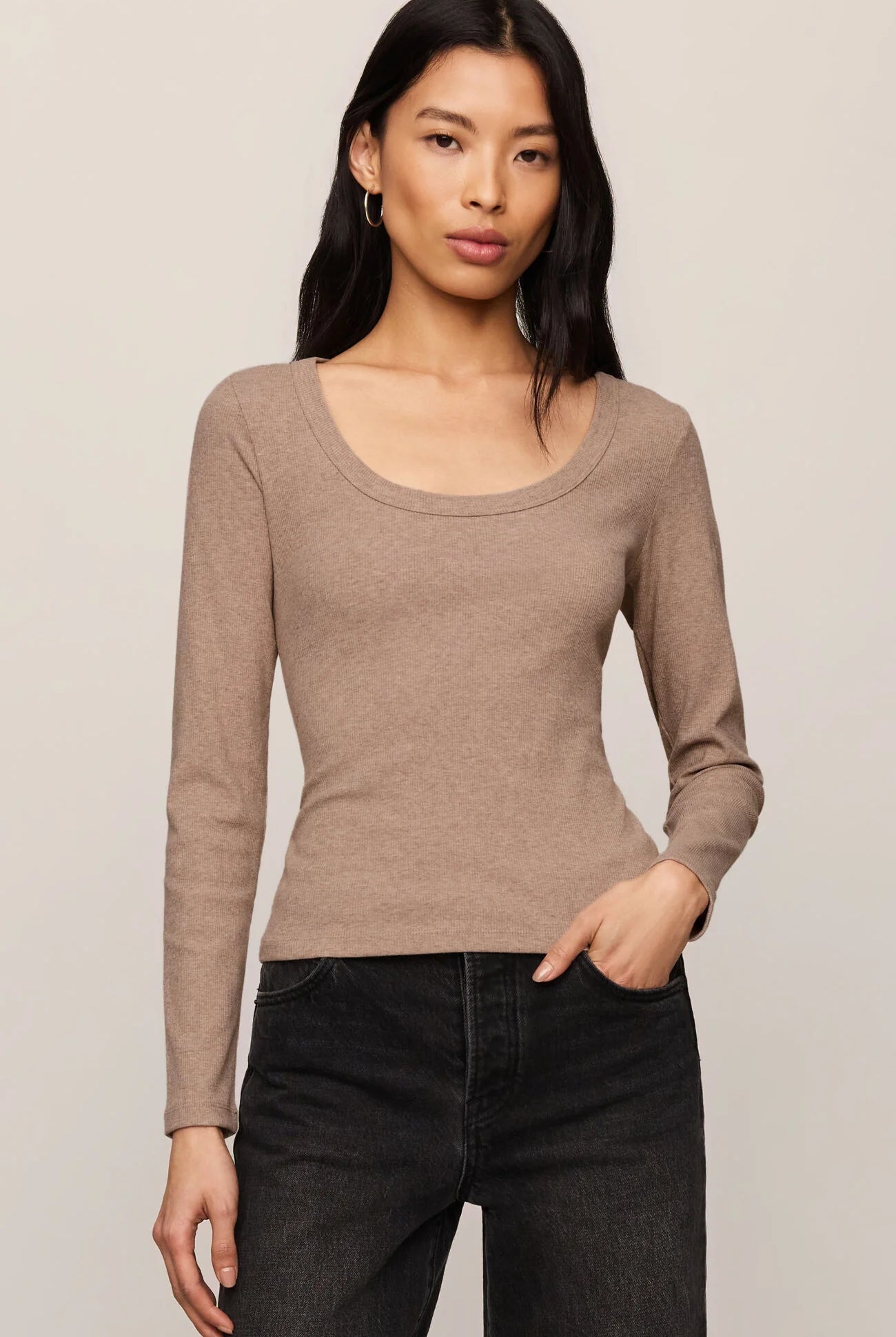 Model wearing the Z Supply Greyson Scoop Long Sleeve in Heather Ash, featuring a fitted rib knit design with a scoop neckline and long sleeves
