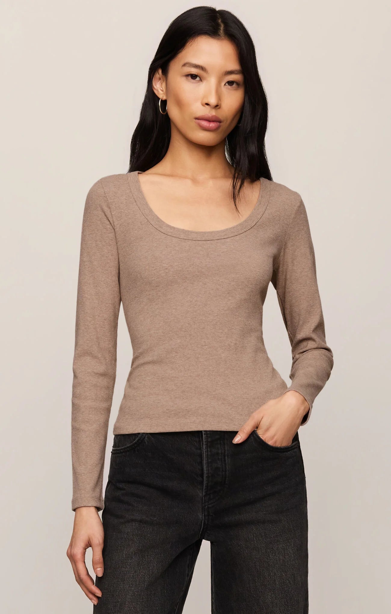 Model wearing the Z Supply Greyson Scoop Long Sleeve in Heather Ash, featuring a fitted rib knit design with a scoop neckline and long sleeves