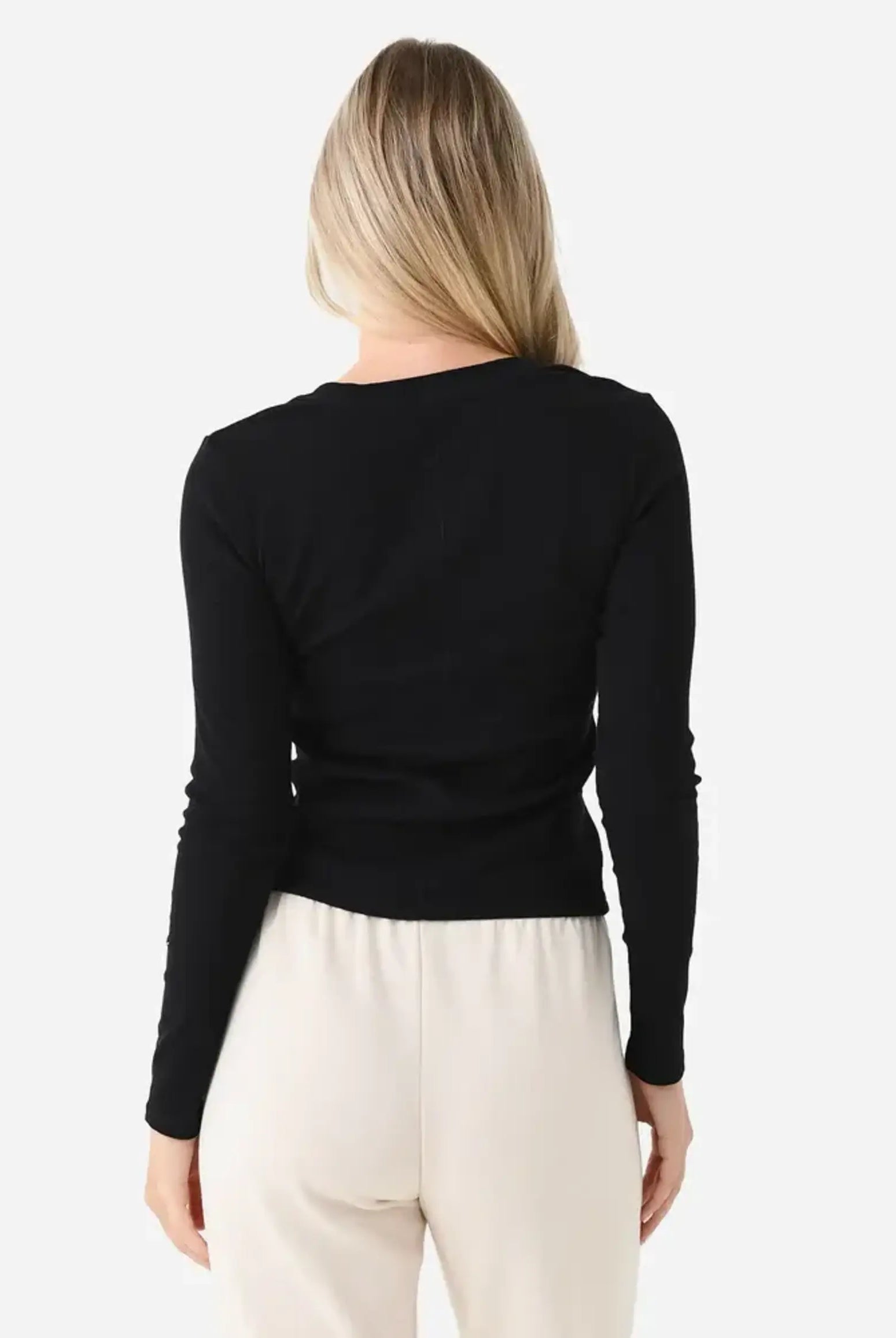 Model wearing the Z Supply Greyson Scoop Long Sleeve featuring a fitted rib knit design with a scoop neckline and long sleeves