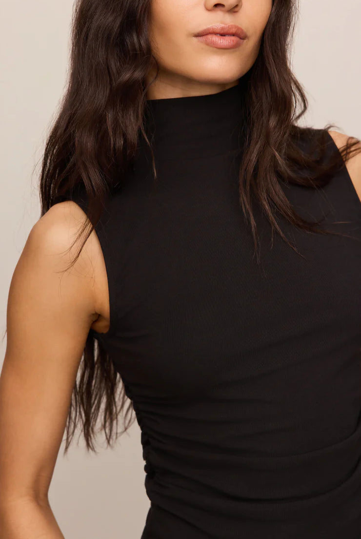 Close-fitting high-neck tank top in soft, stretchy baby rib fabric with subtle side ruching for a flattering, sculpted silhouette. A sleek, fitted essential that's perfect for layering or wearing on its own.