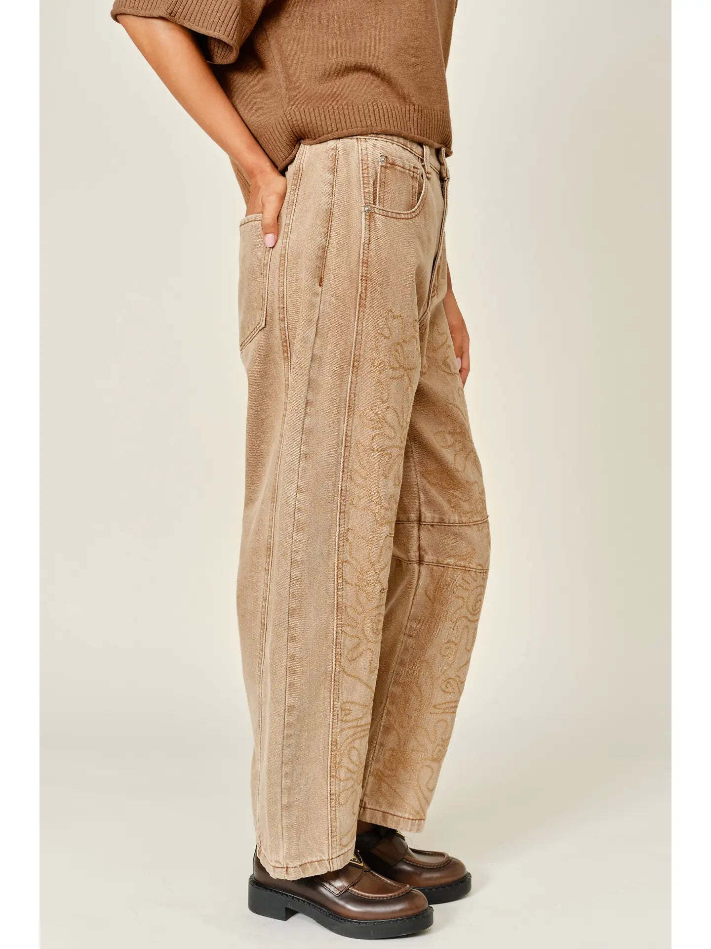 The Ophelia Embroidered Barrel Jeans in rust, featuring tonal floral embroidery, a relaxed barrel-leg silhouette, and a cropped ankle-length fit.