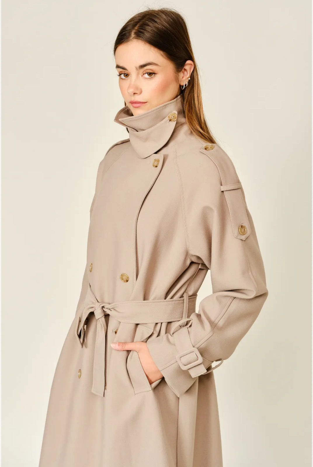 Monroe relaxed longline trench coat in soft, textured fabric, featuring a layered neckline, double-button front closure, and adjustable waist belt for a polished, sophisticated look.