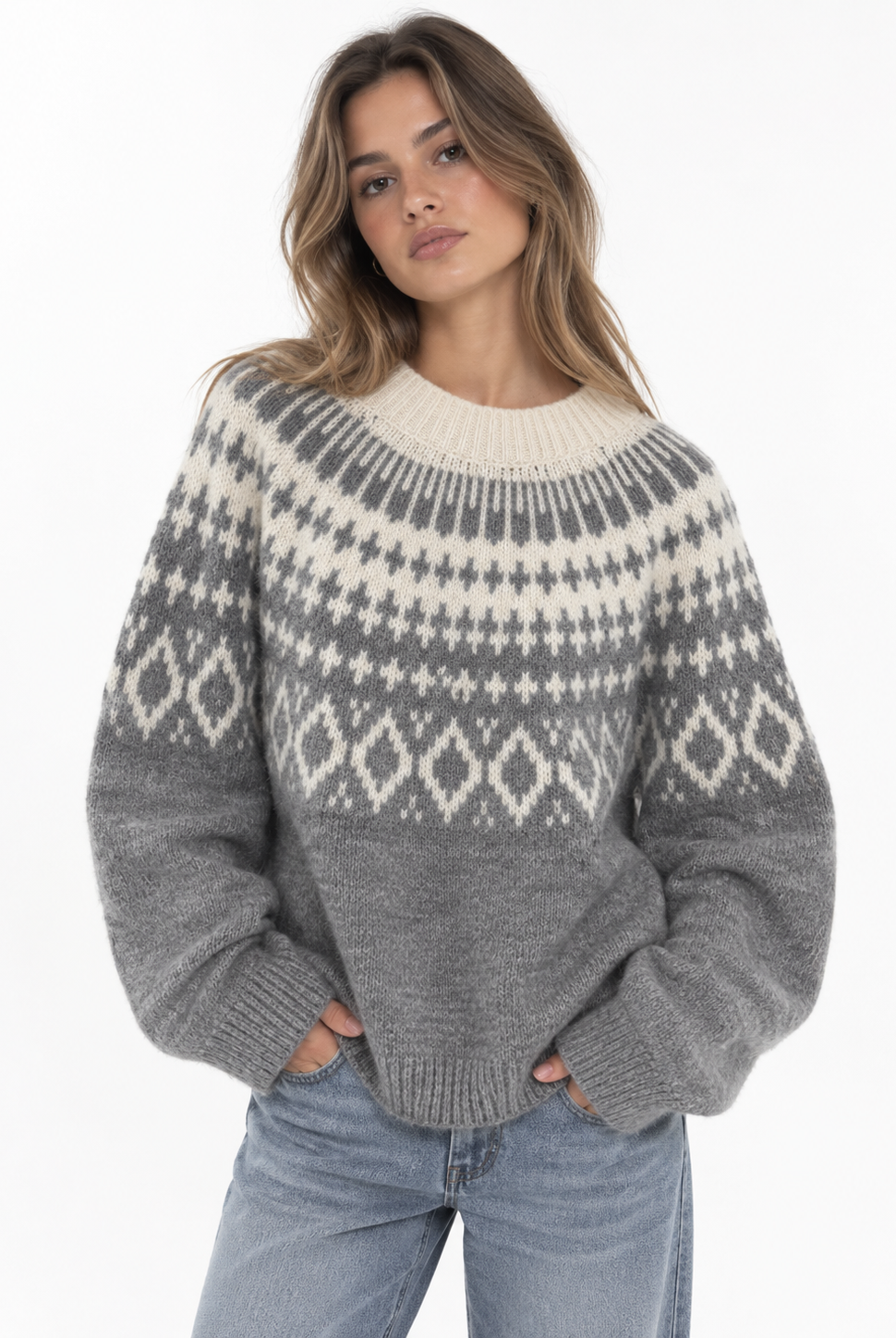 The Brielle Knit Pullover is your new go-to for cozy days. Designed in a soft grey knit with a contrasting cream Nordic-inspired pattern, it features a relaxed fit, classic crew neckline, and easy long sleeves. The perfect statement knit to throw on with denim for an effortlessly put-together fall and winter look.