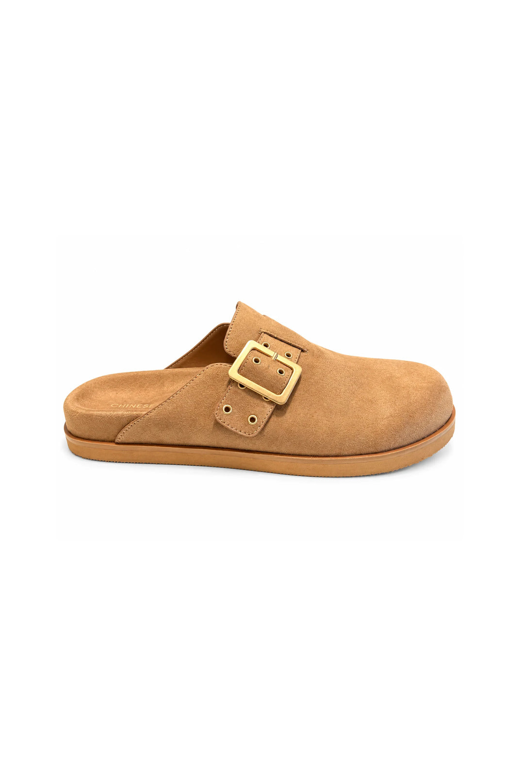 Chinese Laundry Cove suede clogs in natural tan, featuring a rounded closed toe, adjustable strap with gold buckle detailing, and a comfortable slip-on design.
