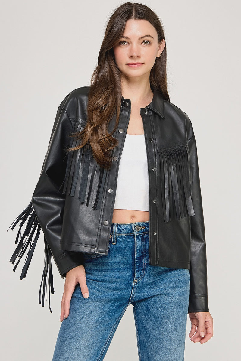 The Dakota Fringe Jacket in black faux leather, featuring bold fringe detailing and a structured silhouette with Western-inspired styling.