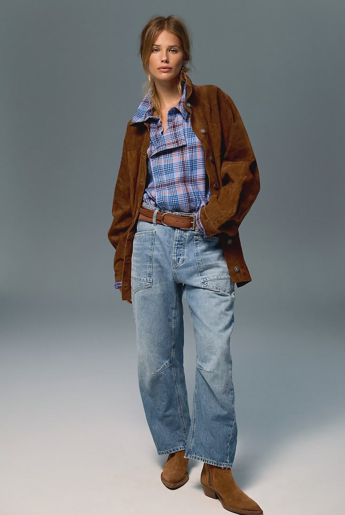 Low-rise barrel-leg pants in rigid denim with a relaxed, slouchy fit, curved leg shape, oversized patch pockets, button-fly closure, and finished hem.