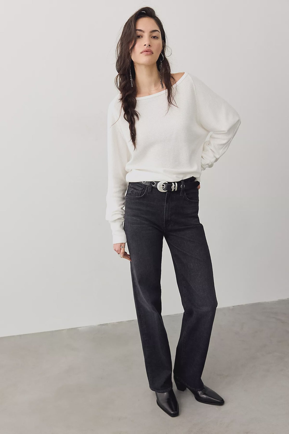 Thermal long-sleeve top featuring a flattering boat neckline, relaxed dolman sleeves, textured cotton-blend fabrication, seamed detailing, and elongated cuffs.