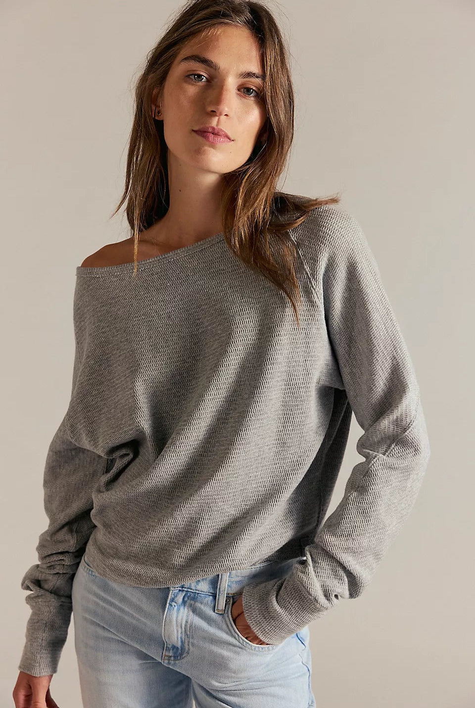 Women's textured thermal long sleeve top with a boat neckline, relaxed dolman sleeves, exposed seam detailing, and elongated cuffs. heather grey.