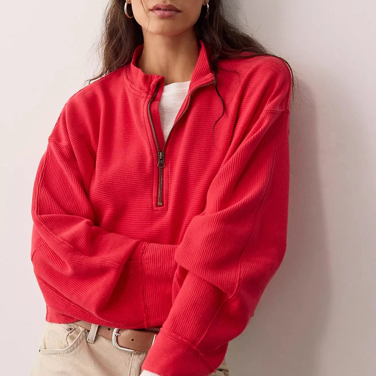 Soft 100% cotton quarter-zip pullover with a slightly cropped, boxy fit, dropped shoulders, long sleeves, and stand collar.