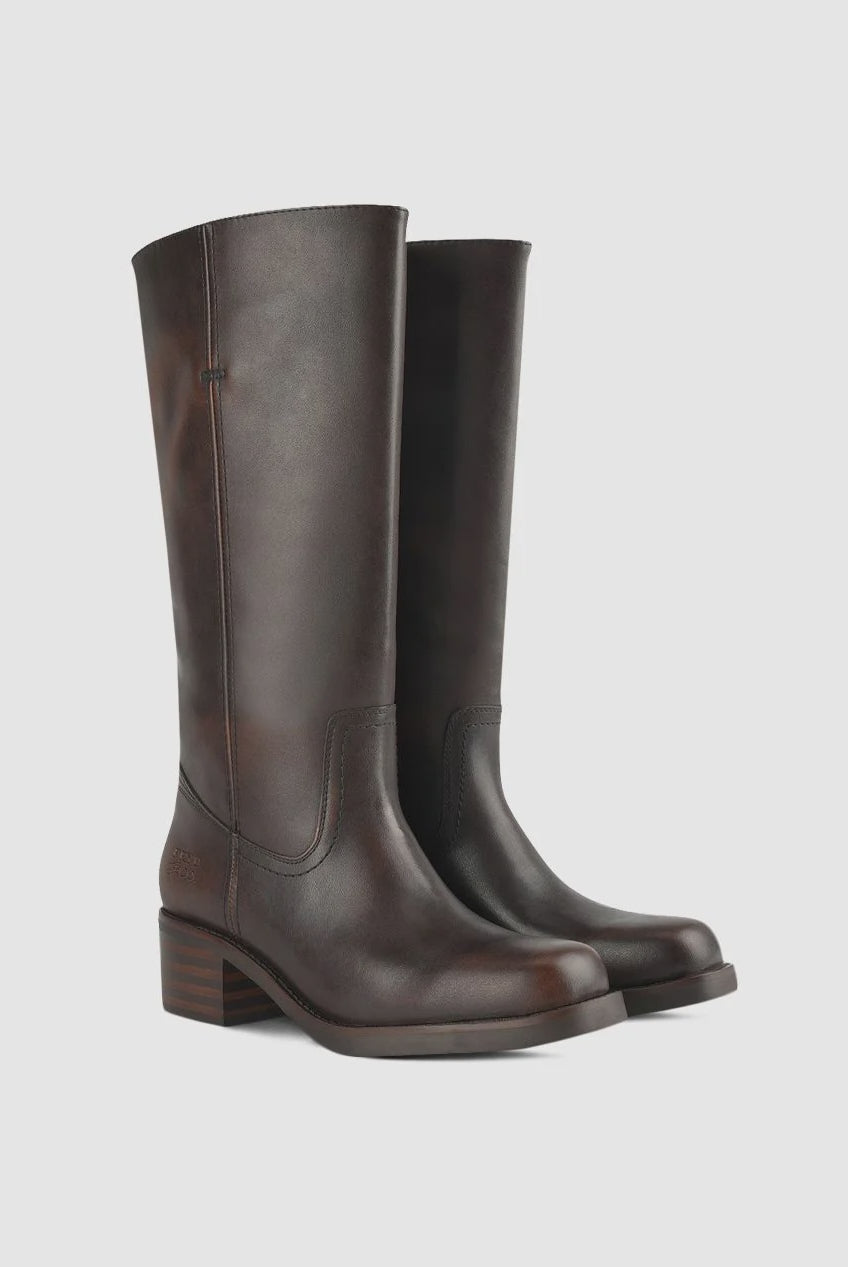 Brown Miranda 14 tall Western-inspired boots featuring a sleek vegan leather finish, square toe, 2-inch stacked block heel, and pull-on design with internal pull loops for easy wear.