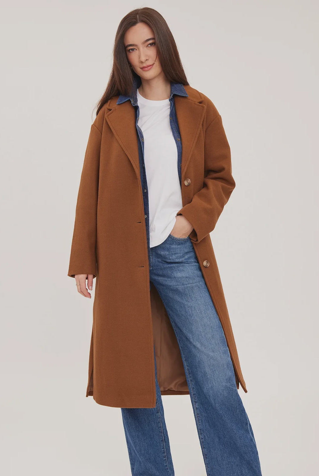 Agatha coat in soft, brushed melton fabric, featuring a front button closure, welt pockets, side slits, and a fully lined interior.