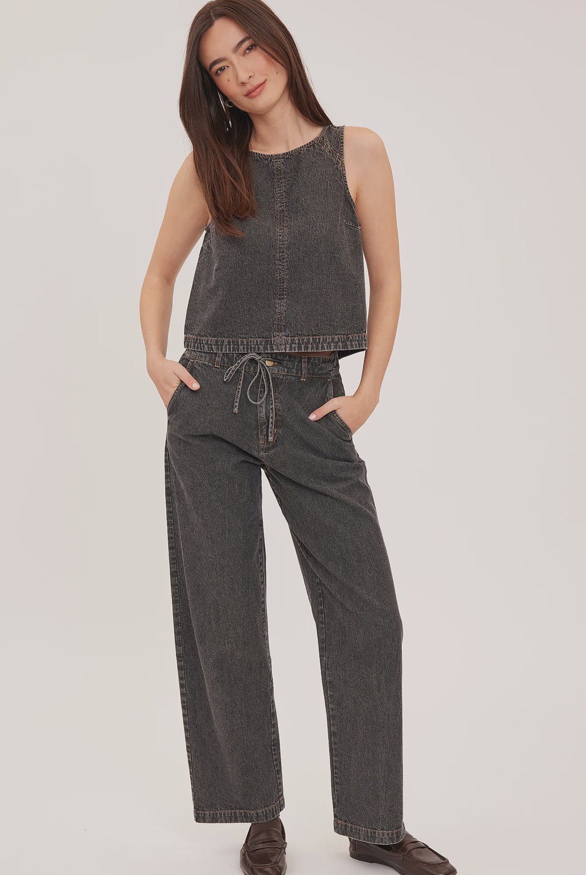 Blaise denim tank top with a lived-in wash, contrast topstitching details, and a back keyhole closure.